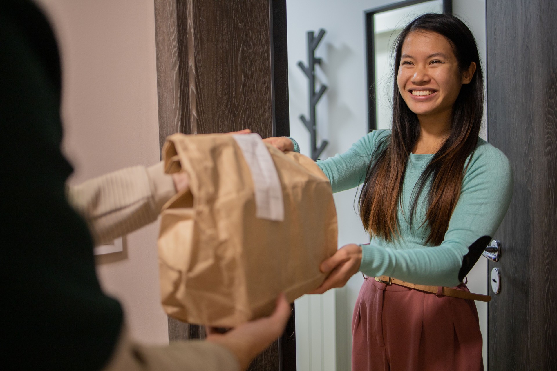 Courier delivering fast food to the customer